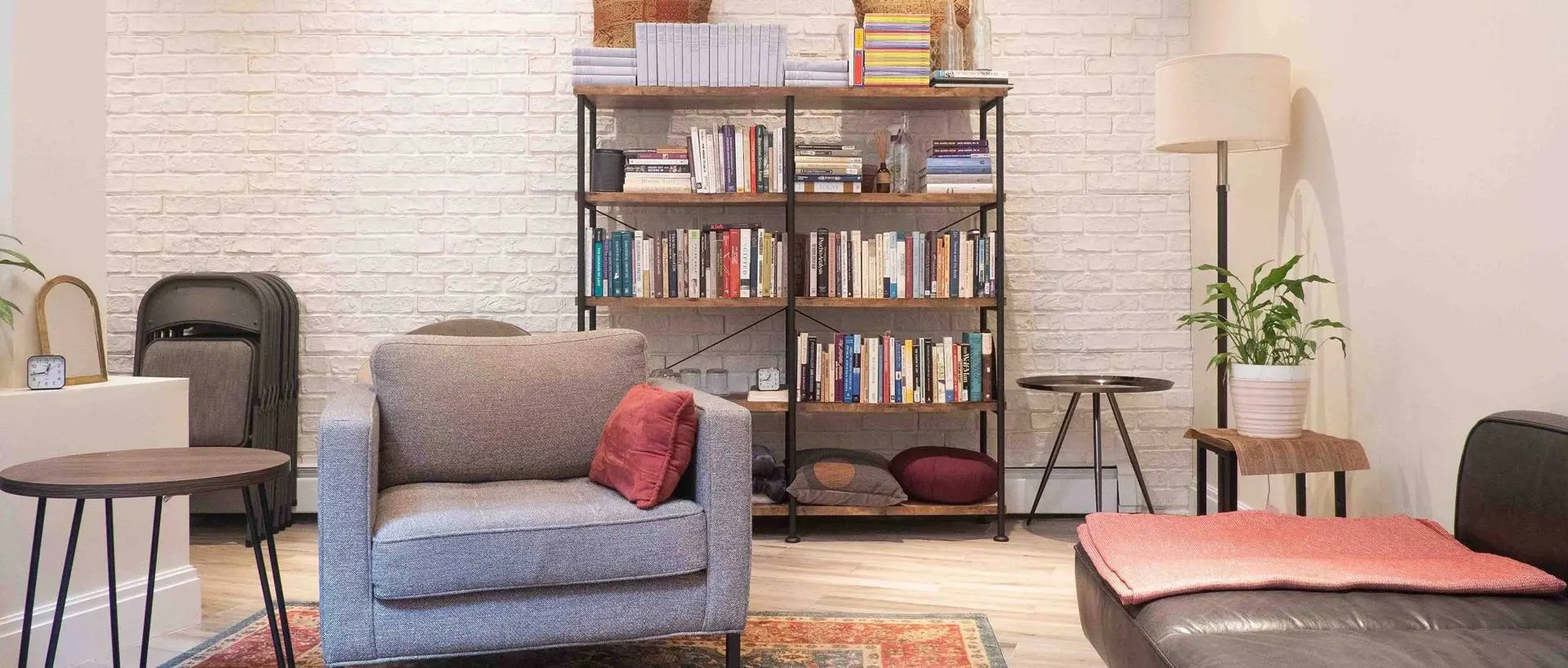 A living room with a couch and bookshelf